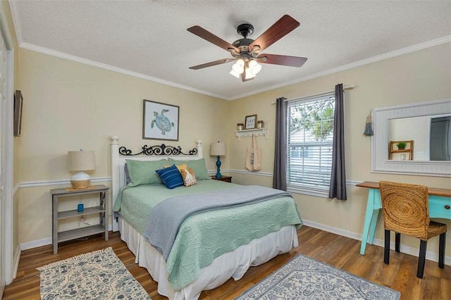 103 Travellers Way, Saint Simons Island, GA 31522 - bedroom featuring wood finished floors, a textured ceiling, ornamental molding, and ceiling fan