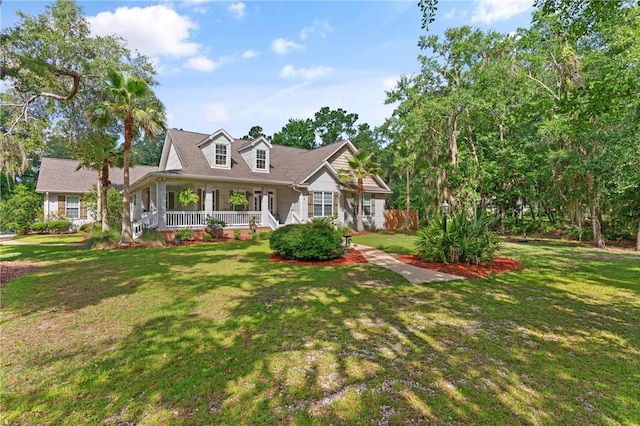 11 Bice Ct, Waverly, GA 31565 - cape cod home with a front yard and a porch