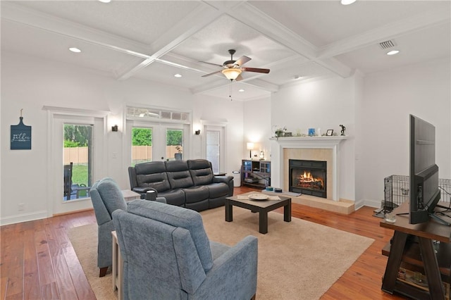11 Bice Ct, Waverly, GA 31565 - living room featuring a fireplace, light wood-type flooring, a ceiling fan, beamed ceiling, and coffered ceiling