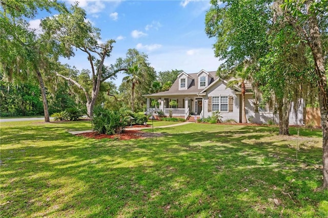 11 Bice Ct, Waverly, GA 31565 - new england style home with covered porch and a front lawn