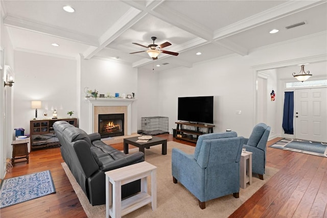 11 Bice Ct, Waverly, GA 31565 - living room featuring light wood-style flooring, beamed ceiling, coffered ceiling, ceiling fan, and a fireplace