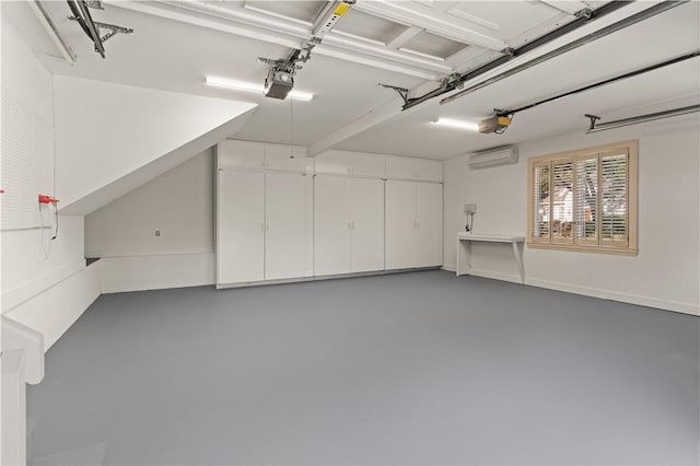 garage with a wall mounted air conditioner and a garage door opener