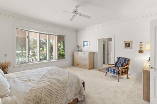 carpeted bedroom featuring ceiling fan and ornamental molding