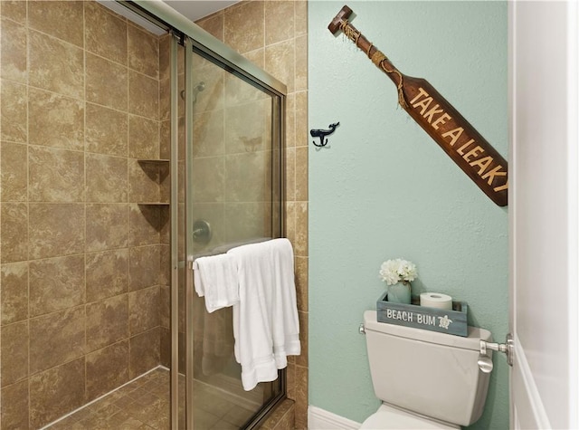 150 Salt Air Dr Unit 219, Saint Simons Island, GA 31522 - bathroom featuring toilet and a stall shower