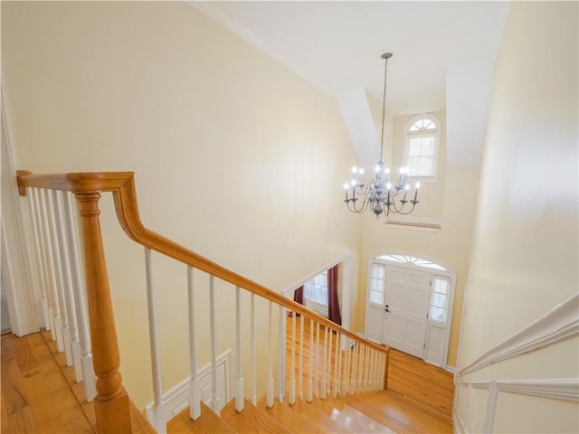 foyer featuring a notable chandelier and light hardwood / wood-style flooring