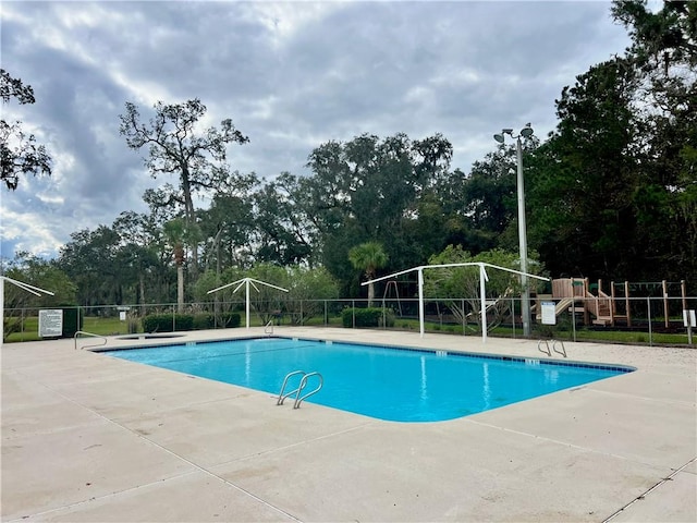 view of swimming pool with a patio