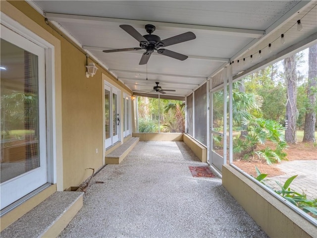 sunroom with ceiling fan and a wealth of natural light