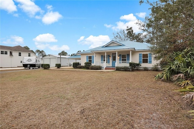 view of front facade with a front yard and covered porch