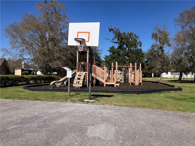 community play area with a lawn