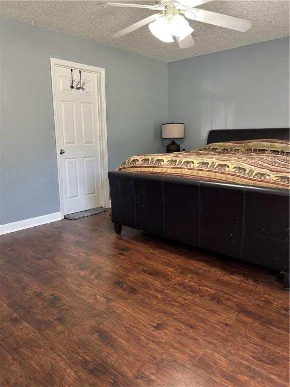 375 Wellington Pl, Brunswick, GA 31523 - bedroom featuring a textured ceiling, dark wood finished floors, and ceiling fan