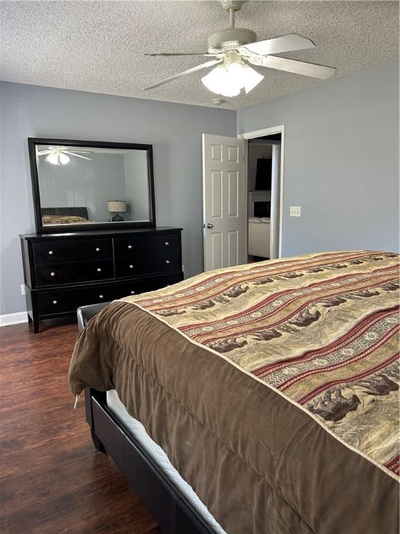 375 Wellington Pl, Brunswick, GA 31523 - bedroom with dark wood-style floors, a textured ceiling, and ceiling fan