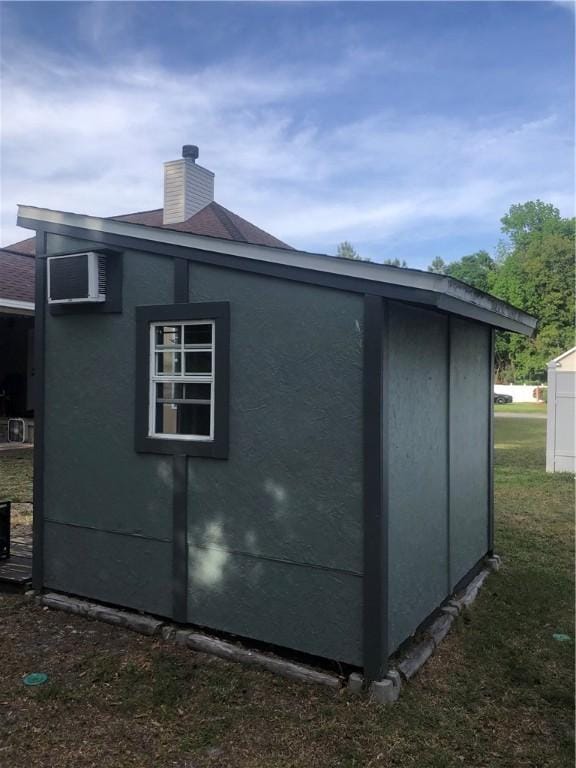 375 Wellington Pl, Brunswick, GA 31523 - view of side of property featuring a chimney and stucco siding