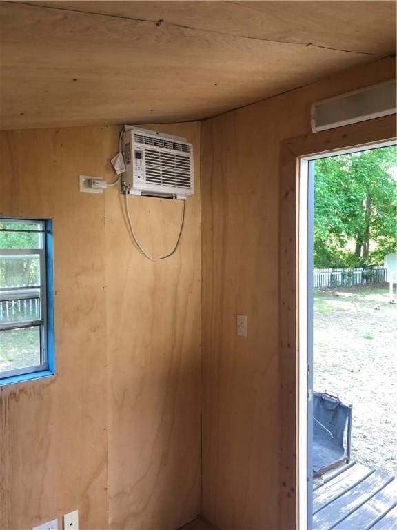 375 Wellington Pl, Brunswick, GA 31523 - interior space with wooden ceiling, an AC wall unit, and wooden walls