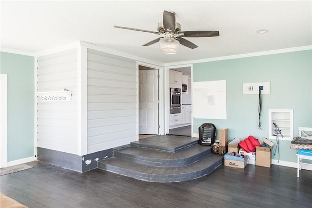 interior space featuring ceiling fan, baseboards, crown molding, and wood finished floors
