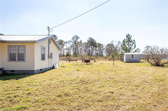 view of yard with a storage unit and an outdoor structure