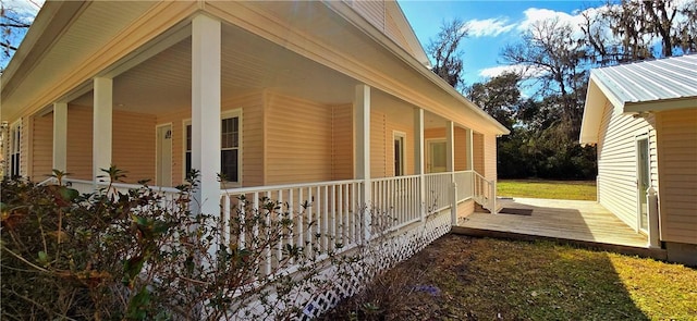 view of side of home with a wooden deck