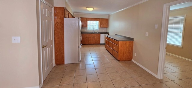 kitchen featuring sink, light tile patterned floors, white refrigerator, ornamental molding, and dishwasher