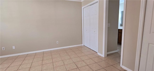 empty room with light tile patterned floors