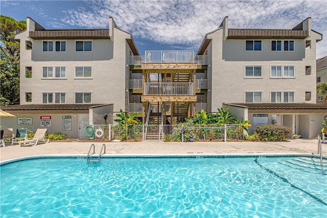 view of swimming pool with a patio