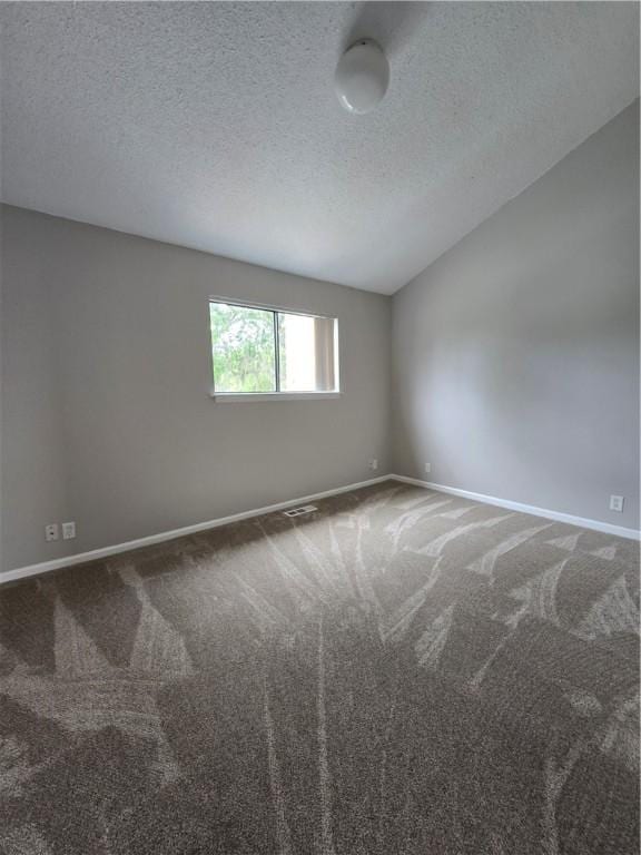 900 Lanier Blvd Unit 6, Brunswick, GA 31520 - carpeted spare room featuring a textured ceiling and lofted ceiling