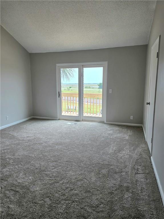 900 Lanier Blvd Unit 6, Brunswick, GA 31520 - spare room with carpet floors and a textured ceiling