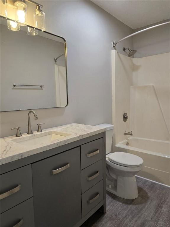 900 Lanier Blvd Unit 6, Brunswick, GA 31520 - full bath with vanity, washtub / shower combination, and wood finished floors