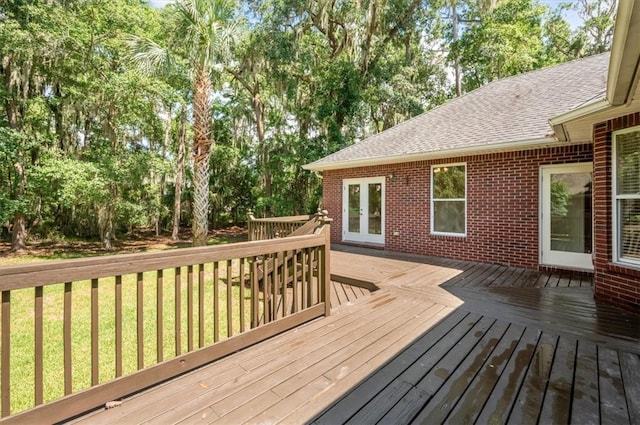 340 Oak Grove Island Dr, Brunswick, GA 31523 - deck featuring a yard, view of wooded area, and french doors