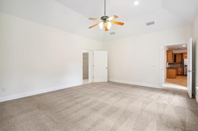 340 Oak Grove Island Dr, Brunswick, GA 31523 - unfurnished bedroom featuring light carpet, stainless steel fridge with ice dispenser, recessed lighting, ceiling fan, and high vaulted ceiling