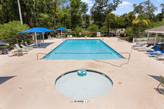 340 Oak Grove Island Dr, Brunswick, GA 31523 - community pool with a patio area and view of scattered trees