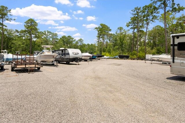 340 Oak Grove Island Dr, Brunswick, GA 31523 - uncovered parking lot with view of scattered trees