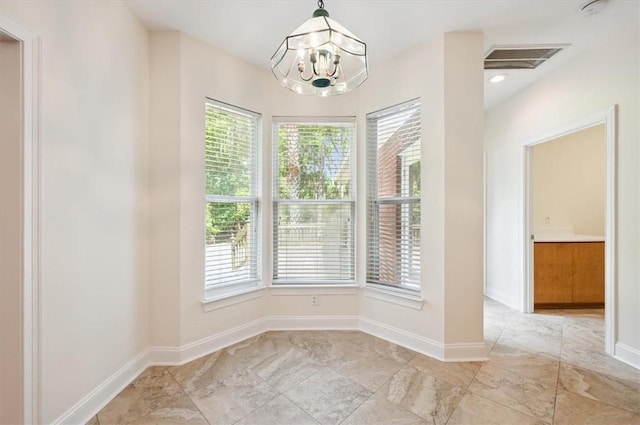 340 Oak Grove Island Dr, Brunswick, GA 31523 - unfurnished dining area with plenty of natural light and a chandelier
