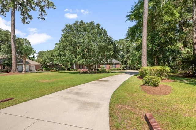 340 Oak Grove Island Dr, Brunswick, GA 31523 - view of community with a lawn and driveway