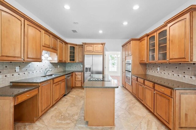 340 Oak Grove Island Dr, Brunswick, GA 31523 - kitchen with stainless steel appliances, a center island, backsplash, recessed lighting, and dark stone countertops