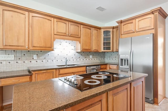 340 Oak Grove Island Dr, Brunswick, GA 31523 - kitchen featuring appliances with stainless steel finishes, glass insert cabinets, dark stone countertops, and decorative backsplash