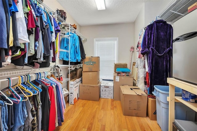 spacious closet with wood finished floors