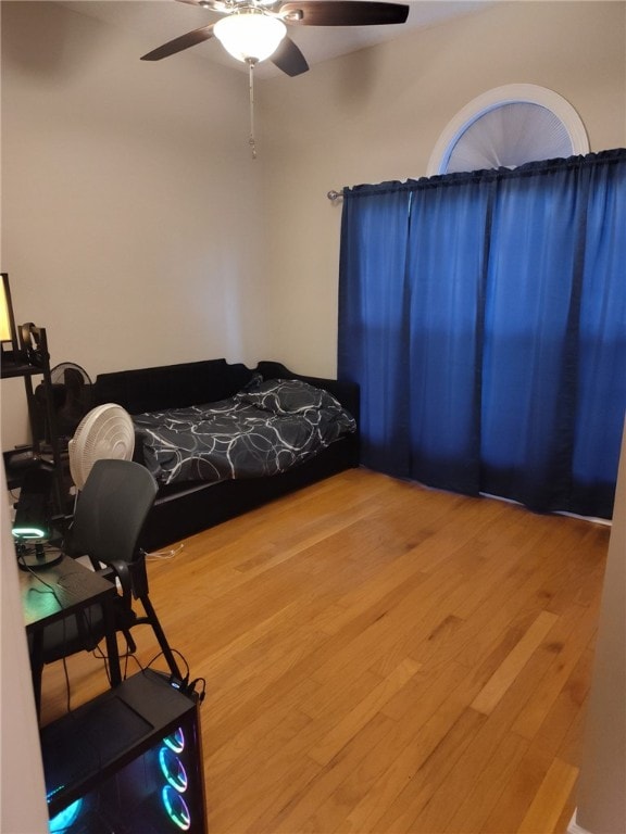 bedroom featuring wood finished floors and a ceiling fan