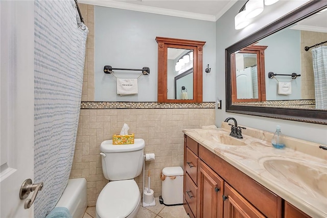 full bathroom featuring shower / bath combo, ornamental molding, vanity, tile walls, and toilet