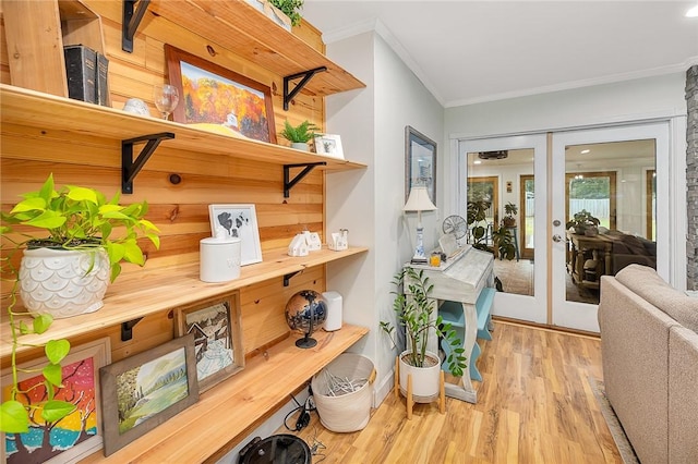 interior space featuring french doors, wood-type flooring, and ornamental molding