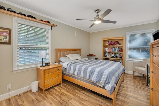 bedroom with light hardwood / wood-style floors, multiple windows, and ceiling fan