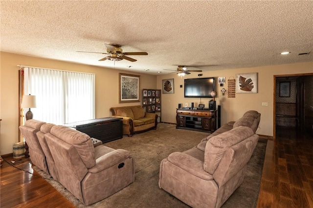 living room featuring dark hardwood / wood-style floors and a textured ceiling