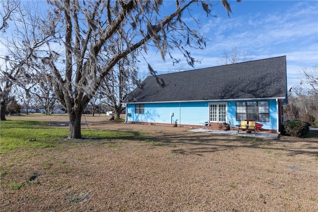 back of house featuring a yard and a patio area