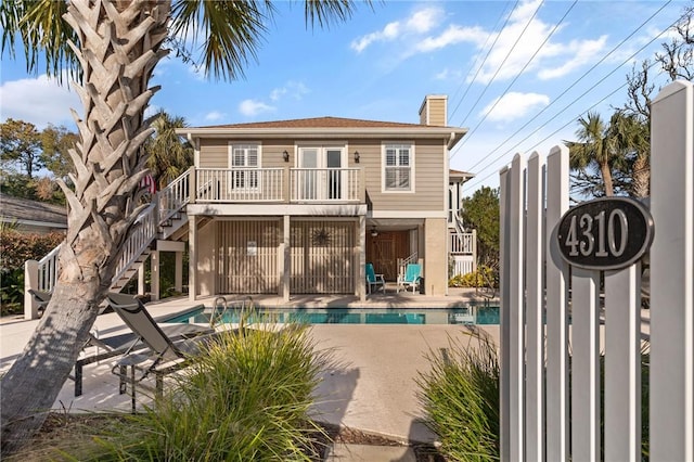 rear view of house with a patio area