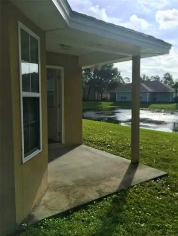 view of patio / terrace featuring a water view