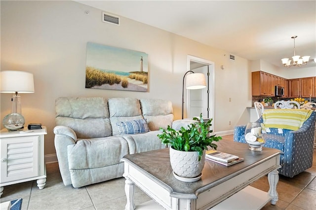 760 Ocean Blvd Unit 201, Saint Simons Island, GA 31522 - living room with a chandelier and light tile patterned floors