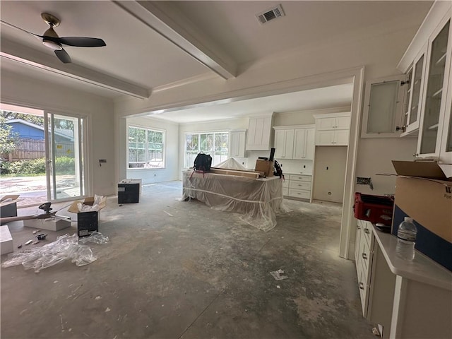 638 Dellwood Ave, Saint Simons Island, GA 31522 - living area featuring beam ceiling and concrete floors