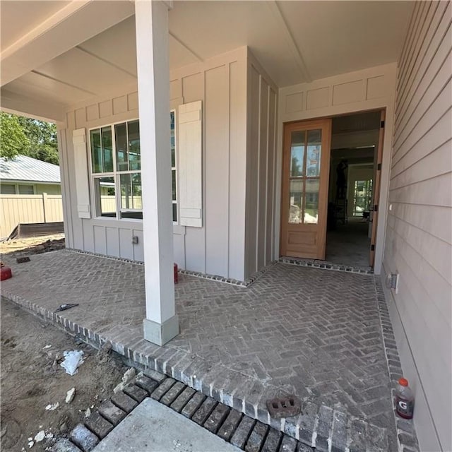 638 Dellwood Ave, Saint Simons Island, GA 31522 - view of exterior entry featuring board and batten siding