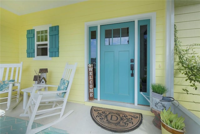 entrance to property with covered porch