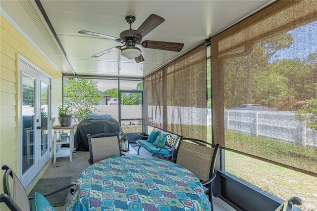 sunroom with ceiling fan and a wealth of natural light