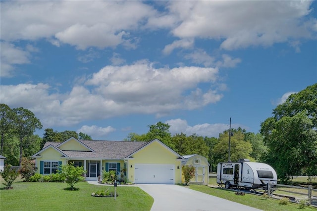 ranch-style home with concrete driveway, an attached garage, and a front lawn