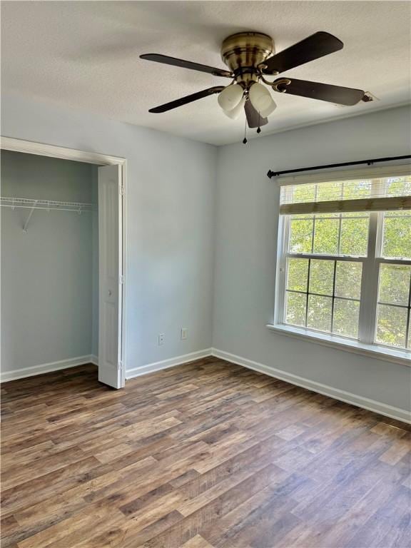 111 Covington Pointe Dr, Brunswick, GA 31523 - unfurnished bedroom featuring wood finished floors, a closet, and ceiling fan